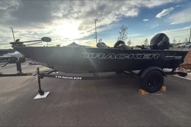 The Image of 2027 Tracker Super Guide V-16 T boat on trailer under cloudy sky. - 0