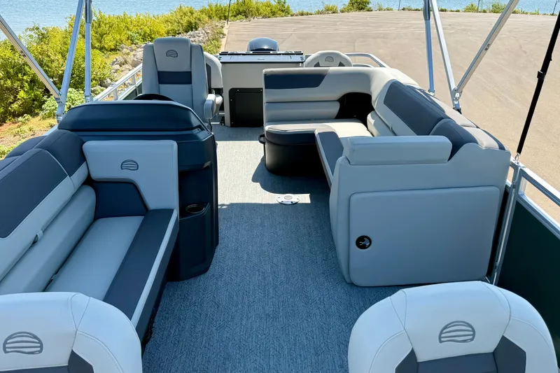 Slide: The Image of 2027 Sun Tracker Fishin' Barge 22 DLX interior with spacious seating and modern design. - 19