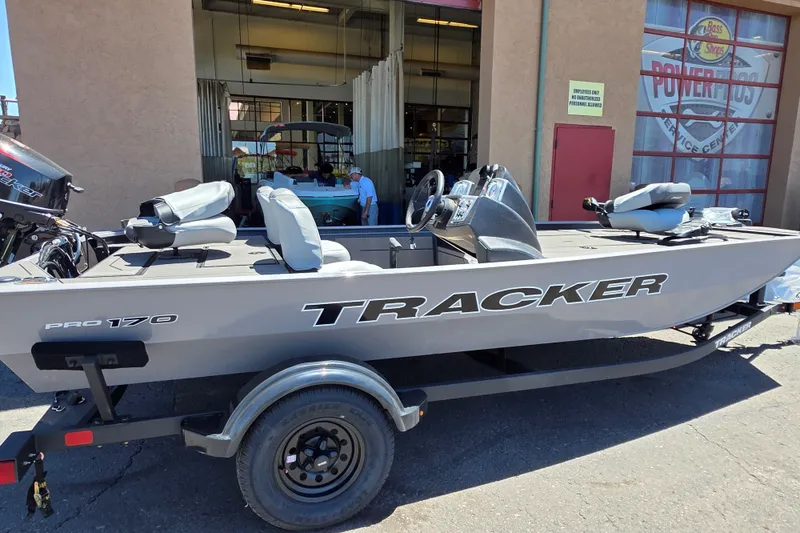 The Image of 2027 Tracker Pro 170 boat on trailer outside service center. - 0