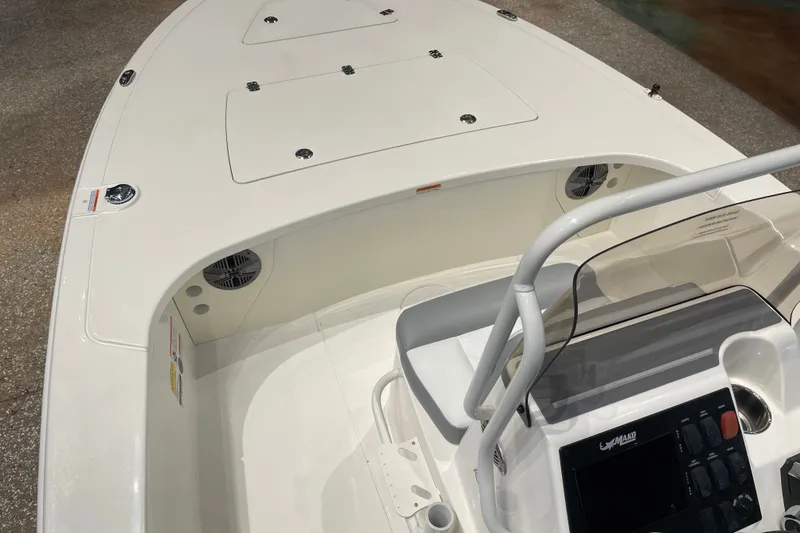 Slide: The Image of 2026 Mako 18 Pro Skiff boat interior with console and seating area. - 5
