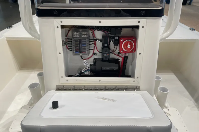 Slide: The Image of Electrical panel inside a 2026 Mako 18 Pro Skiff boat, showcasing wiring and components. - 7