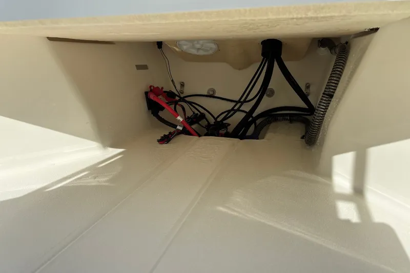 Slide: The Image of Interior view of 2026 Mako Pro Skiff 13 CC boat showing wiring and components. - 18