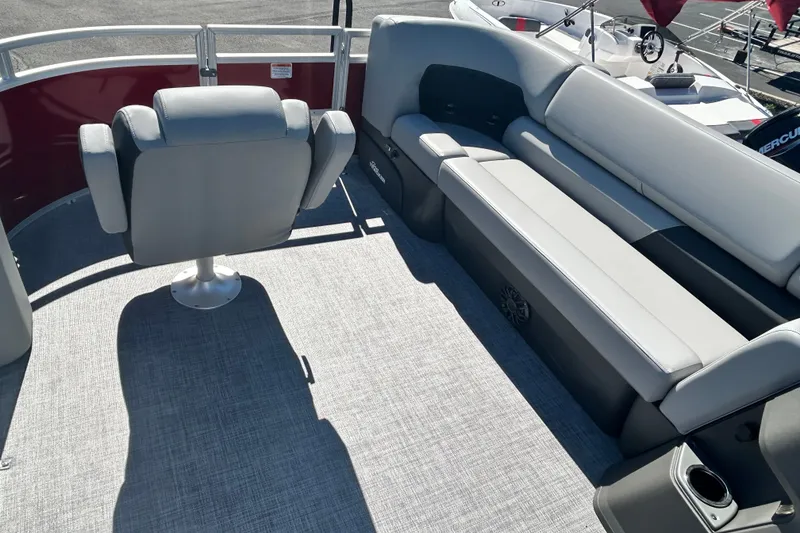 Slide: The Image of 2027 Sun Tracker SportFish 20 DLX boat interior with gray seating and carpeted floor. - 16