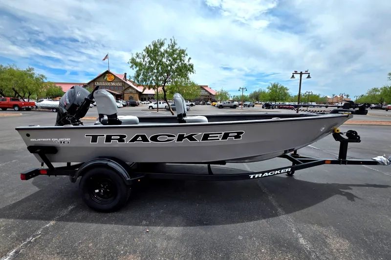 The Image of 2027 Tracker Super Guide V-16 T boat on trailer in parking lot. - 0