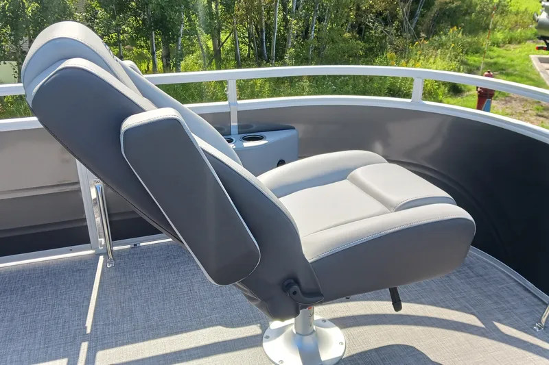 Slide: The Image of Luxurious seating on 2027 Sun Tracker SportFish 20 DLX pontoon boat, featuring sleek design. - 13