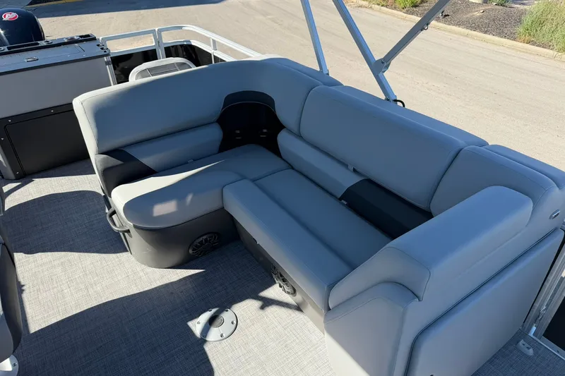 Slide: The Image of 2027 Sun Tracker SportFish 20 DLX pontoon boat with gray seating and spacious layout. - 20