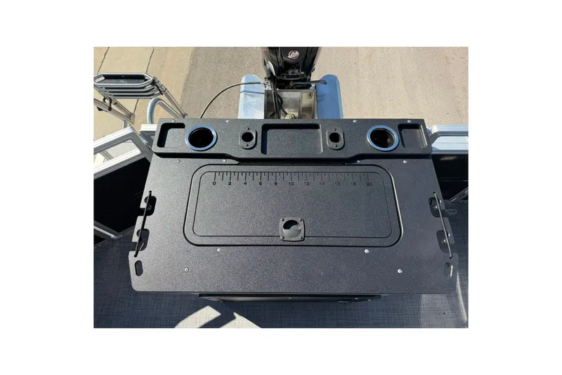 Slide: The Image of Fishing station on 2027 Sun Tracker SportFish 20 DLX pontoon boat, featuring cup holders and ruler. - 24