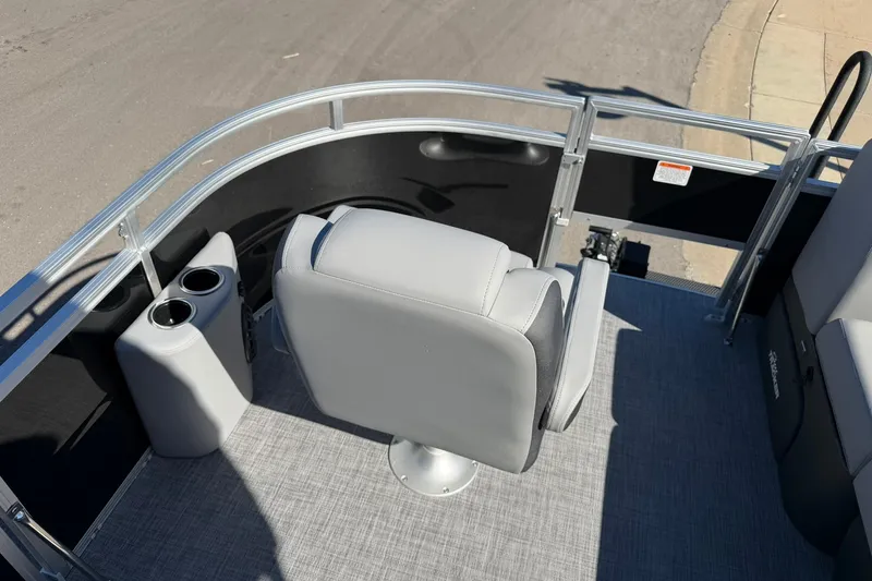 Slide: The Image of 2027 Sun Tracker SportFish 20 DLX boat interior with gray seating and cup holders. - 17