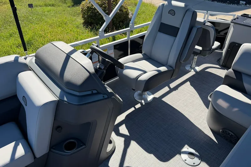 Slide: The Image of 2027 Sun Tracker SportFish 20 DLX interior with modern seating and steering console. - 19