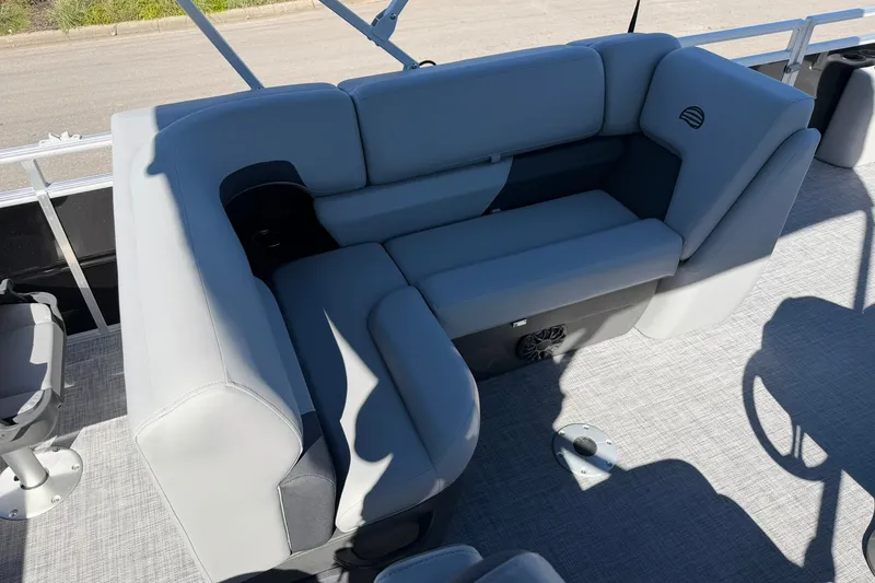 Slide: The Image of 2027 Sun Tracker SportFish 20 DLX boat interior with gray cushioned seating and cup holder. - 22