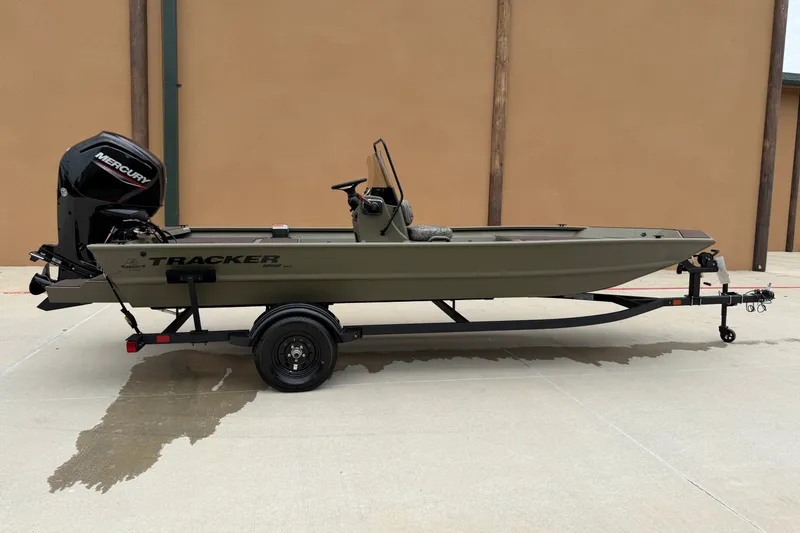 The Image of 2027 Tracker Grizzly 1860 CC boat on trailer, featuring Mercury outboard motor. - 0