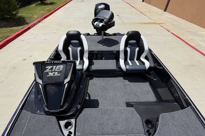 Slide: The Image of 2027 Nitro Z18 XL Pro boat interior with dual seats and sleek design. - 5