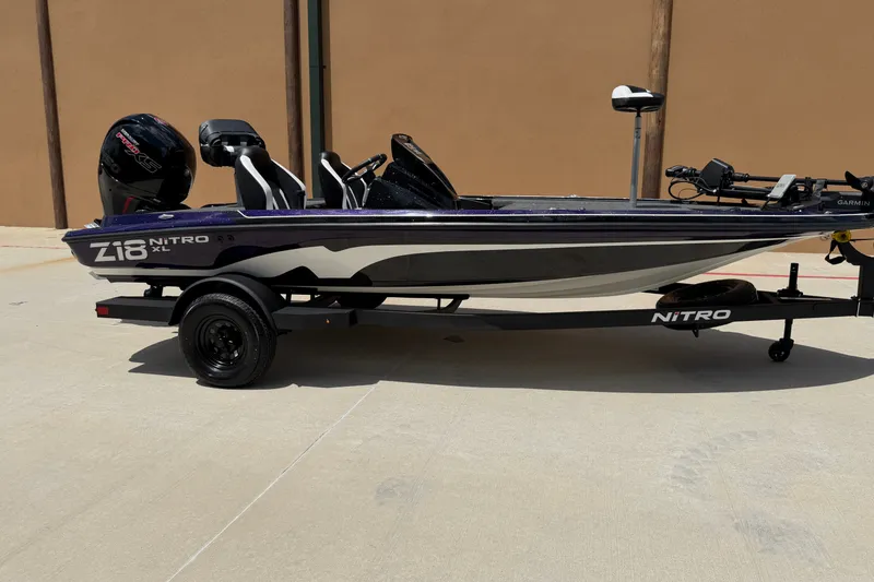 Slide: The Image of 2027 Nitro Z18 XL Pro boat on trailer, side view in outdoor setting. - 1