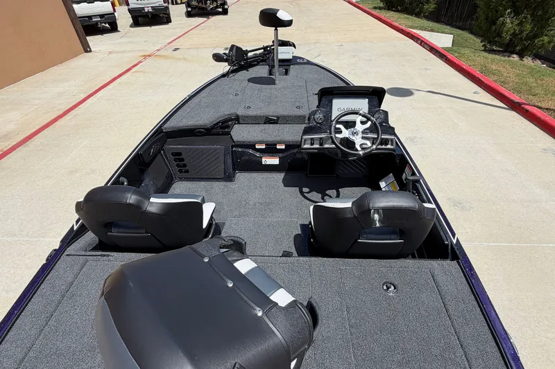 Slide: The Image of 2027 Nitro Z18 XL Pro boat interior with steering wheel and seating. - 4