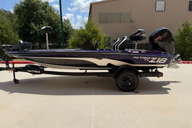 The Image of 2027 Nitro Z18 XL Pro boat on trailer, parked outdoors. - 0