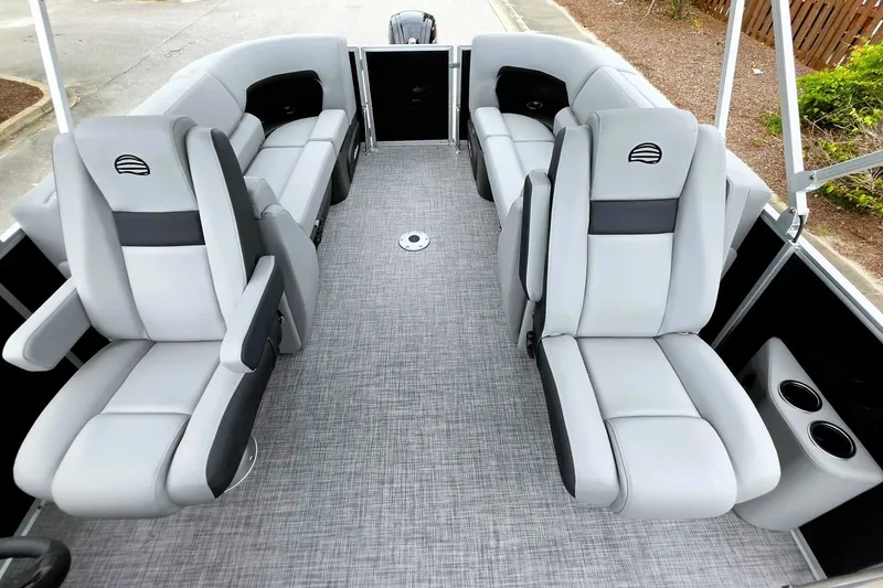 Slide: The Image of 2027 Sun Tracker Party Barge 22 DLX interior with plush seating and modern design. - 15