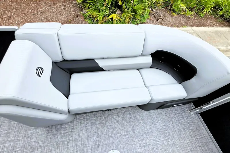 Slide: The Image of 2027 Sun Tracker Party Barge 22 DLX pontoon boat seating, featuring plush gray upholstery. - 19