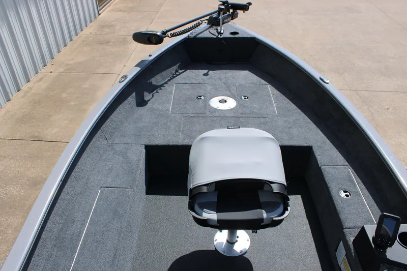 Slide: The Image of 2027 Tracker Super Guide V-16 T boat interior with seating and fishing equipment. - 16