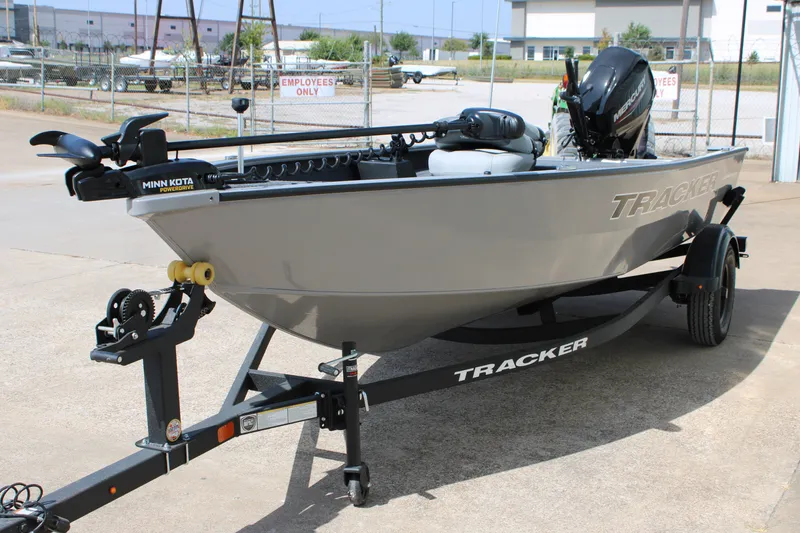 Slide: The Image of 2027 Tracker Super Guide V-16 T boat on trailer, featuring Minn Kota motor. - 15