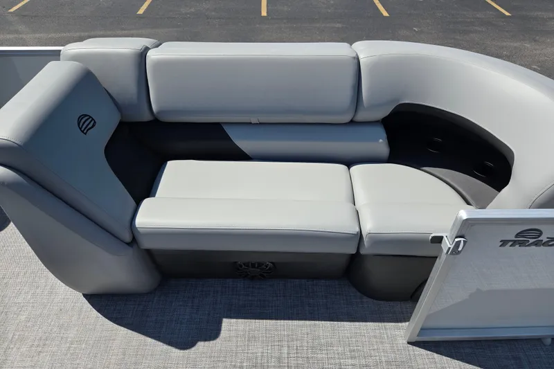 Slide: The Image of 2027 Sun Tracker Party Barge 20 DLX pontoon boat seating area, featuring plush gray upholstery. - 12