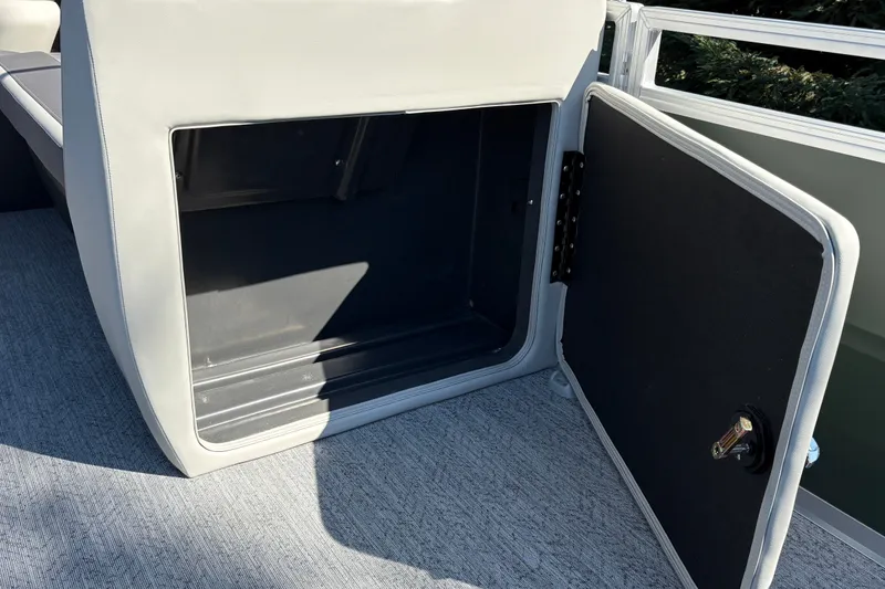 Slide: The Image of Open storage compartment on 2027 Sun Tracker Fishin' Barge 22 DLX boat. - 39