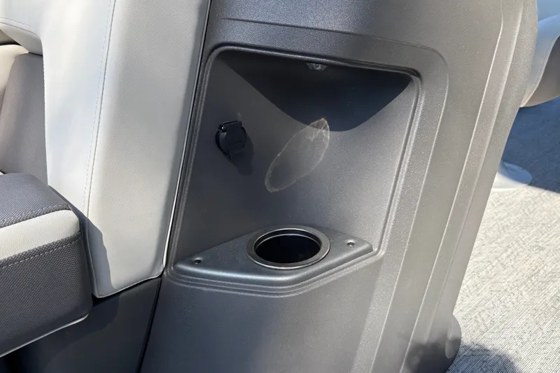 Slide: The Image of Interior detail of 2027 Sun Tracker Fishin' Barge 22 DLX with cup holder and storage. - 32