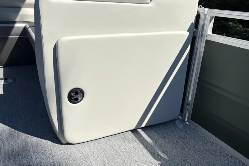 Slide: The Image of 2027 Sun Tracker Fishin' Barge 22 DLX interior detail, featuring a sleek storage compartment. - 35