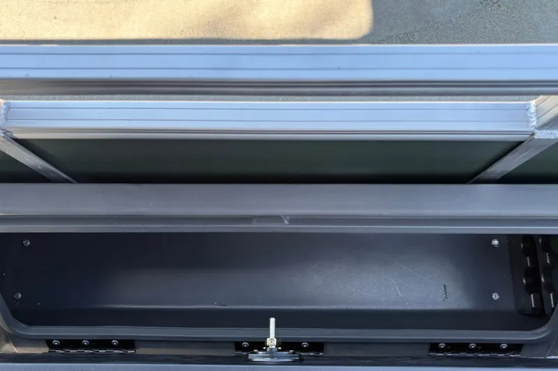 Slide: The Image of Storage compartment on a 2027 Sun Tracker Fishin' Barge 22 DLX pontoon boat. - 23