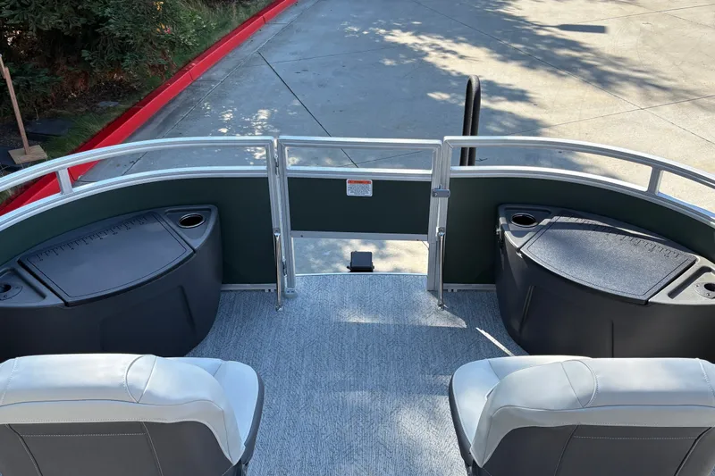 Slide: The Image of 2027 Sun Tracker Fishin' Barge 22 DLX interior with seating and storage compartments. - 33