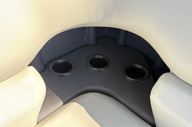 Slide: The Image of Cup holders on Sun Tracker Fishin' Barge 22 DLX 2027 boat, beige seating. - 20