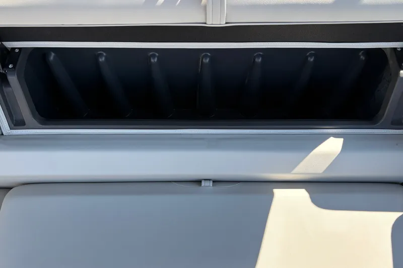 Slide: The Image of Storage compartment on 2027 Sun Tracker Fishin' Barge 22 DLX boat, featuring sleek design. - 22