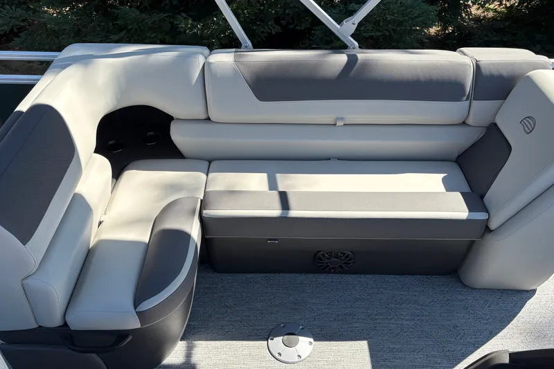 Slide: The Image of Luxurious seating on 2027 Sun Tracker Fishin' Barge 22 DLX pontoon boat, featuring plush cushions. - 17
