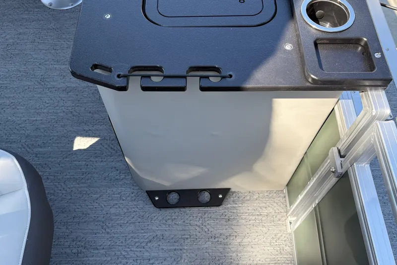 Slide: The Image of 2027 Sun Tracker Fishin' Barge 22 DLX console with cup holder and storage compartment. - 31