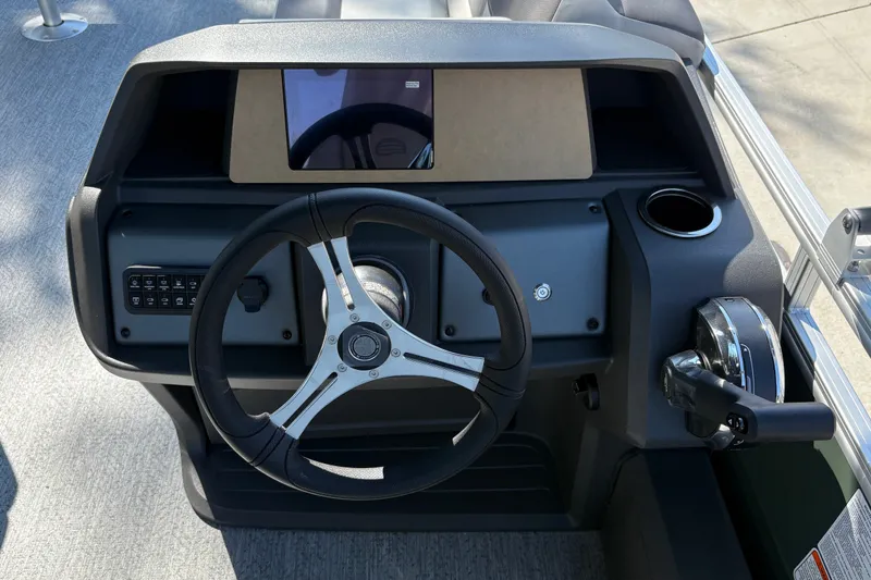 Slide: The Image of Steering console of 2027 Sun Tracker Fishin' Barge 22 DLX with modern controls. - 26