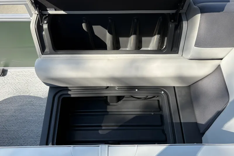 Slide: The Image of Open storage compartment on 2027 Sun Tracker Fishin' Barge 22 DLX boat. - 25