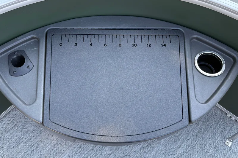 Slide: The Image of Fishing station with ruler and cup holder on 2027 Sun Tracker Fishin' Barge 22 DLX. - 45