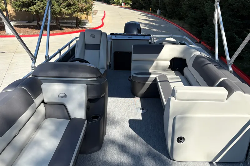 Slide: The Image of 2027 Sun Tracker Fishin' Barge 22 DLX interior with spacious seating and modern design. - 19