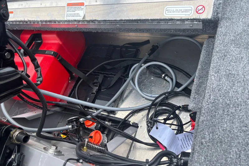 Slide: The Image of Interior view of a 2027 Tracker Super Guide V-16 T boat showing wiring and fuel tank. - 13