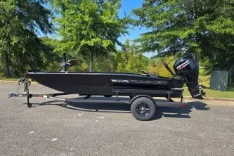 The Image of 2027 Tracker Grizzly 1756 T Marsh boat on trailer, parked outdoors. - 0