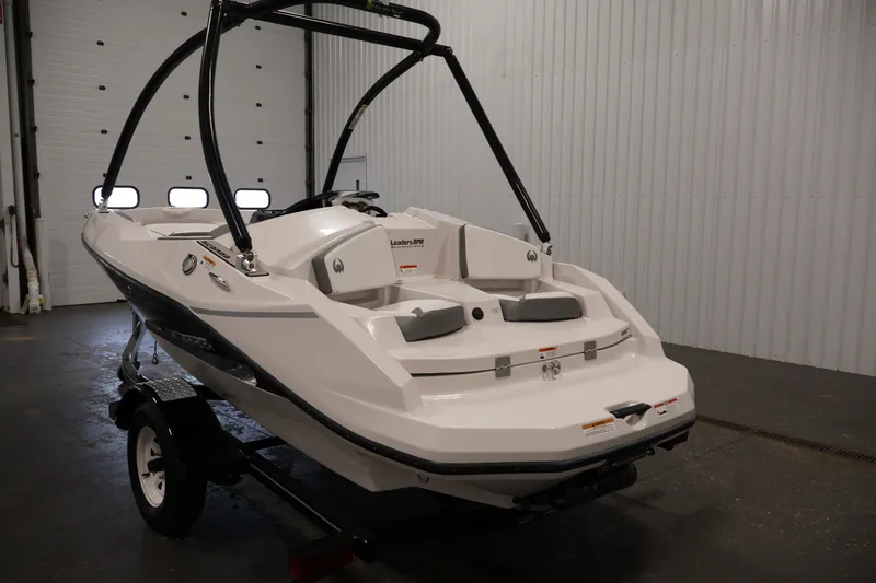 Slide: The Image of 2019 Scarab 165 G jet boat in a garage, rear view. - 6