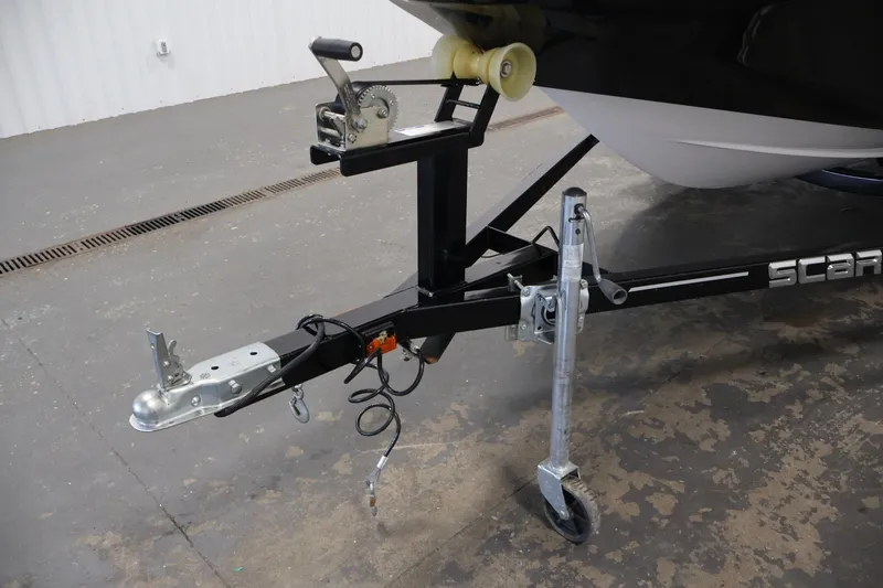 Slide: The Image of Trailer hitch and winch of a 2019 Scarab 165 G boat trailer. - 30