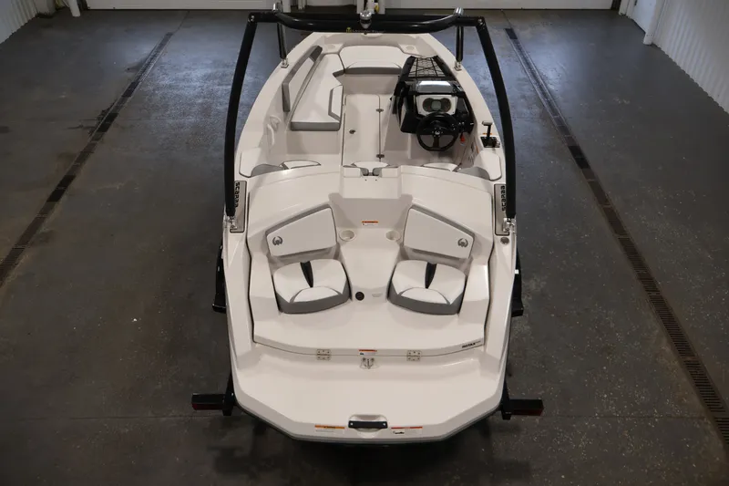Slide: The Image of 2019 Scarab 165 G boat interior, featuring sleek seating and modern controls in a spacious layout. - 9