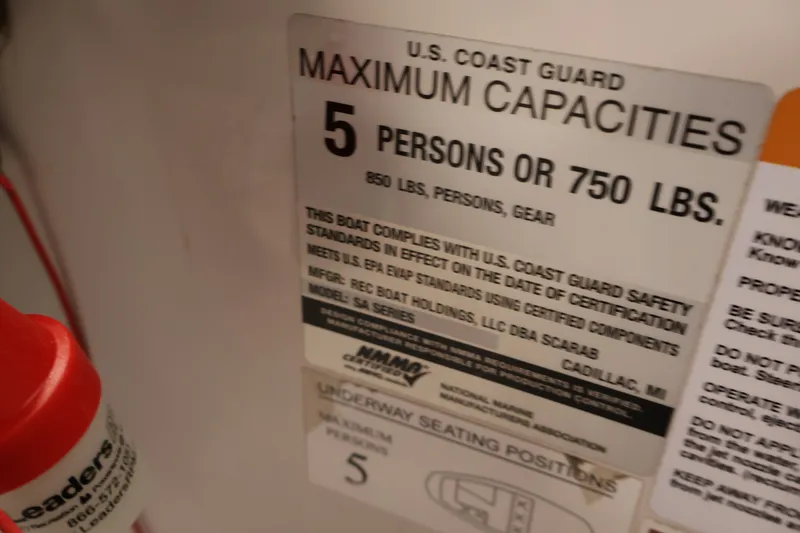 Slide: The Image of U.S. Coast Guard capacity label for Scarab 165 G, 2019 model, 5 persons or 750 lbs. - 21