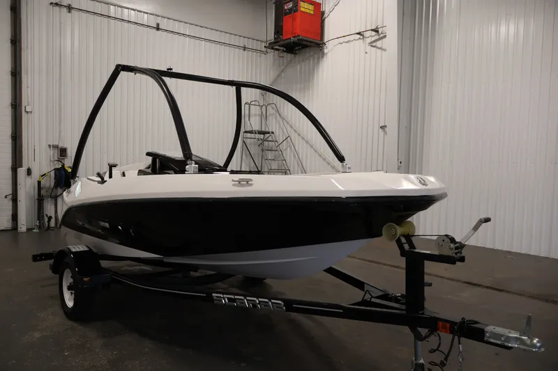 Slide: The Image of 2019 Scarab 165 G boat on trailer in indoor storage facility. - 2