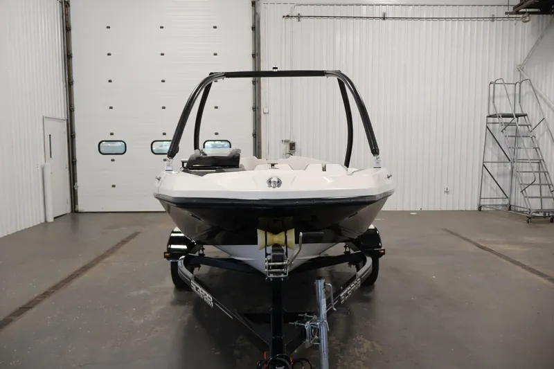 Slide: The Image of 2019 Scarab 165 G boat in a garage, front view on trailer. - 1