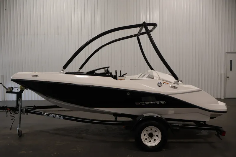 Slide: The Image of 2019 Scarab 165 G boat on trailer in indoor setting. - 7