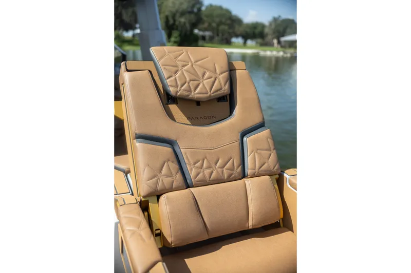 Slide: The Image of Luxurious tan seating on 2026 Nautique Super Air Nautique G25 Paragon boat. - 21