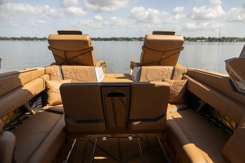 Slide: The Image of Luxurious interior of 2026 Nautique Super Air Nautique G25 Paragon boat on a serene lake. - 20
