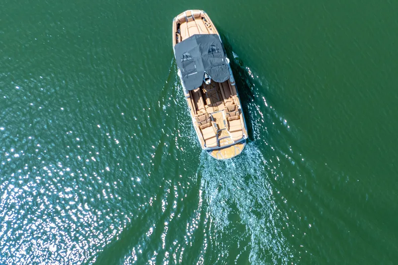 Slide: The Image of Aerial view of 2026 Nautique Super Air Nautique G25 Paragon on green water. - 4