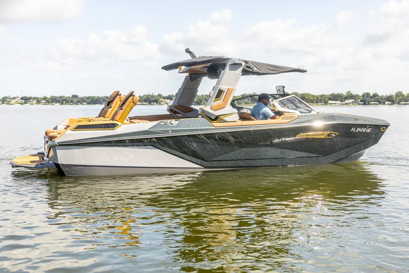 Slide: The Image of 2026 Nautique Super Air Nautique G25 Paragon on a serene lake. - 10